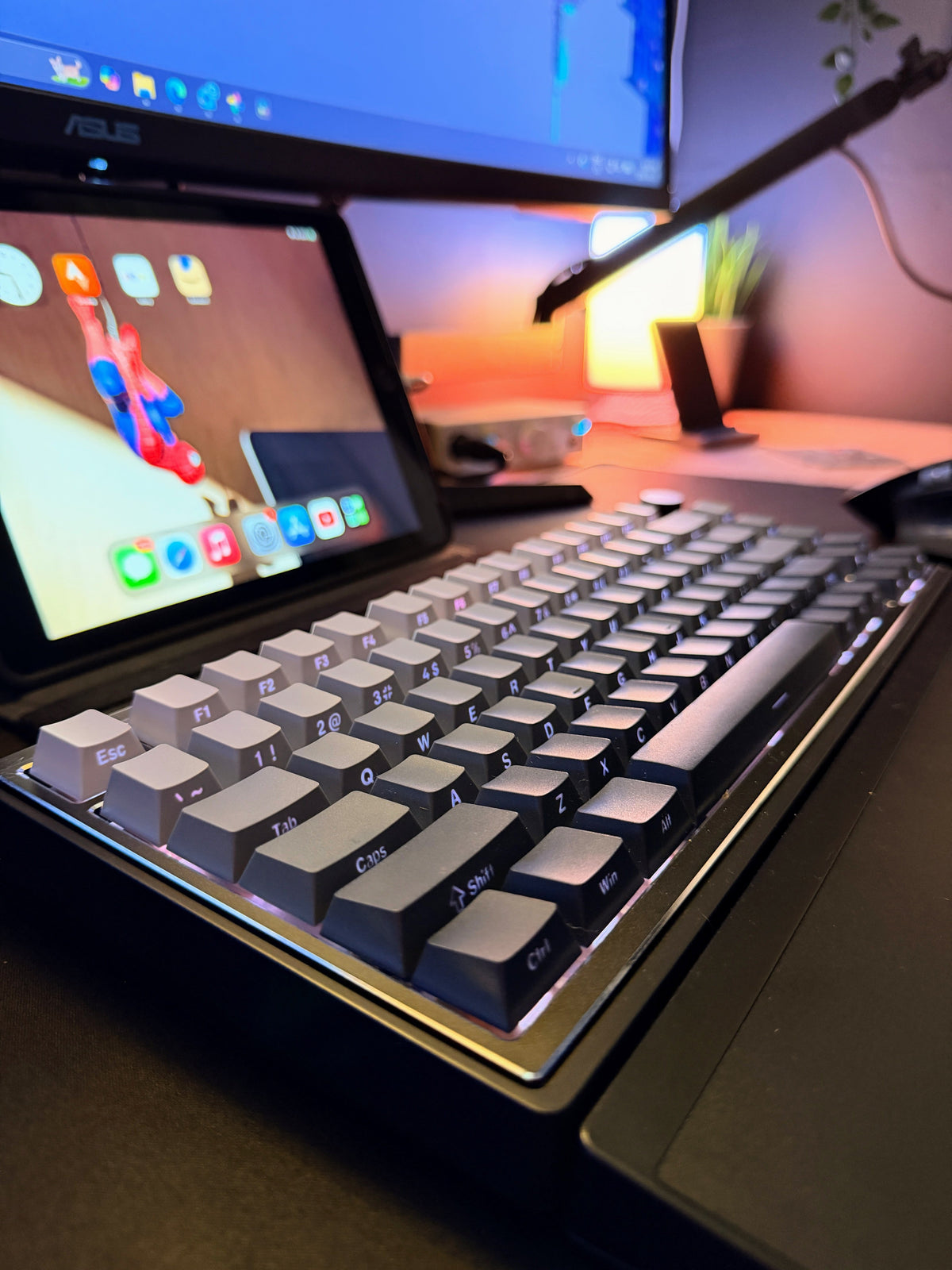 A closer look at the 75% wireless keyboard's side-printed legends, gradient keycaps and foldable aluminum palm rest.