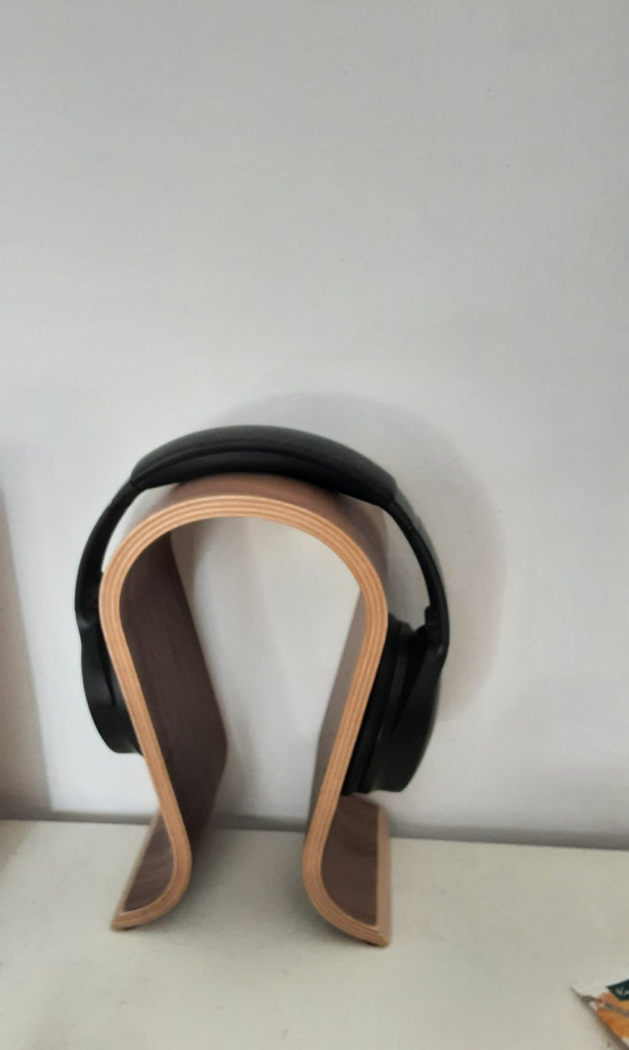 It stands stably, looks excellent and does what it's supposed to: hold the headphones.